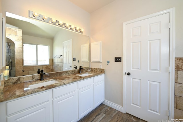 13607 Stagecoach, San Antonio, TX 78253 - bathroom with double vanity, wood finished floors, and baseboards
