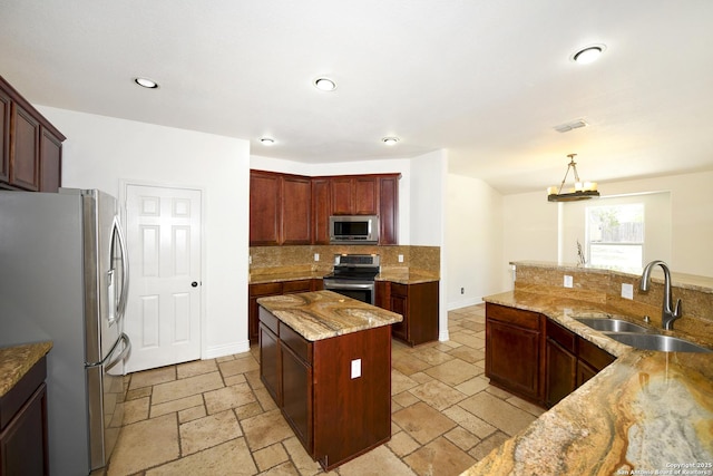 13607 Stagecoach, San Antonio, TX 78253 - kitchen with appliances with stainless steel finishes, a sink, stone tile floors, backsplash, and recessed lighting