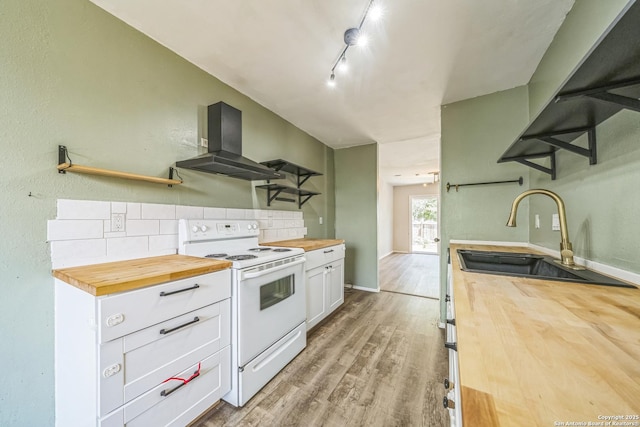 3501 Ridge Knoll St, San Antonio, TX 78247 - kitchen with wood counters, electric range, extractor fan, tasteful backsplash, and open shelves