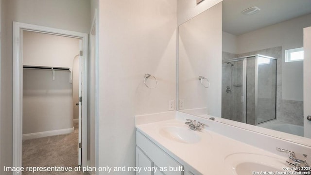 21003 Millstream Bnd, San Antonio, TX 78266 - full bathroom with a shower stall, a walk in closet, double vanity, and a tub to relax in