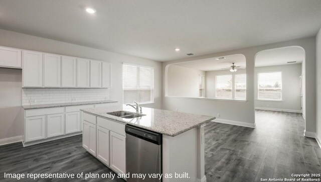 21003 Millstream Bnd, San Antonio, TX 78266 - kitchen featuring dishwasher, a sink, white cabinetry, healthy amount of natural light, and recessed lighting
