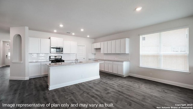 21003 Millstream Bnd, San Antonio, TX 78266 - kitchen featuring stainless steel appliances, tasteful backsplash, white cabinetry, and recessed lighting