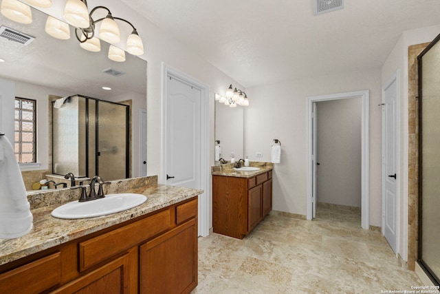 116 Cold Riv, Boerne, TX 78006 - full bathroom featuring a stall shower and two vanities