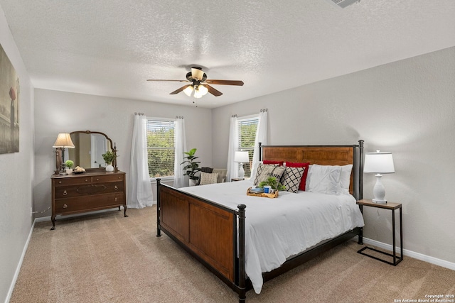 116 Cold Riv, Boerne, TX 78006 - bedroom with light carpet, a textured ceiling, and ceiling fan