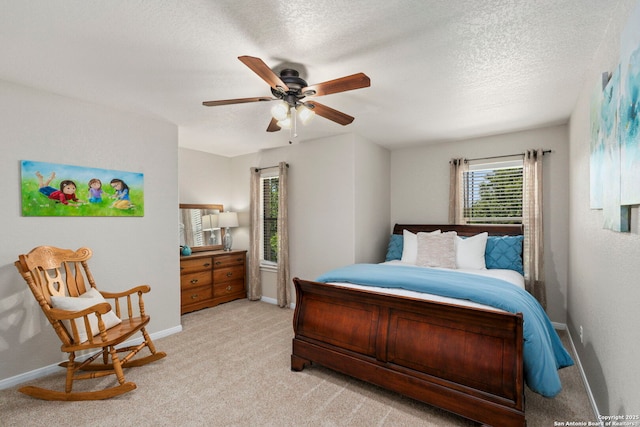 116 Cold Riv, Boerne, TX 78006 - bedroom featuring light carpet, ceiling fan, and a textured ceiling