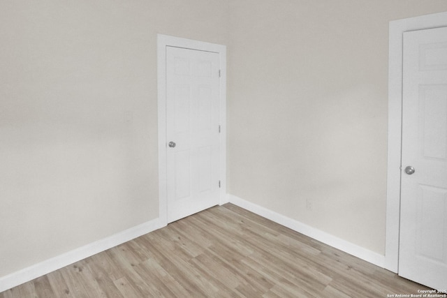 2402 W Martin St, San Antonio, TX 78207 - unfurnished room with light wood-style floors and baseboards