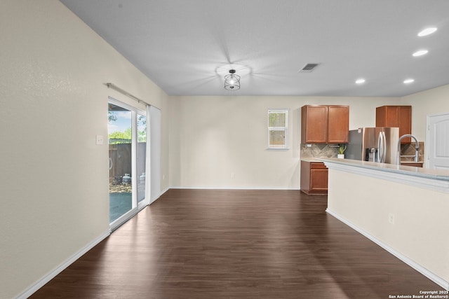 220 Hinge, Cibolo, TX 78108 - unfurnished living room featuring dark wood-type flooring and recessed lighting