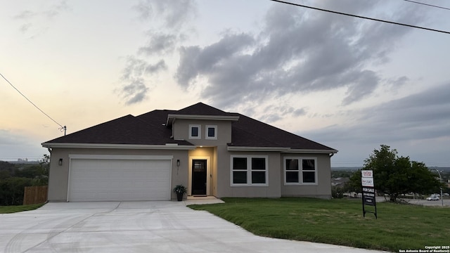 7919 Deerfield Blvd, Selma, TX 78154 - prairie-style house with an attached garage, stucco siding, driveway, and a front yard