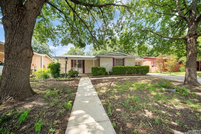7022 Centergrove Dr, San Antonio, TX 78227 - view of front of property with brick siding and a porch