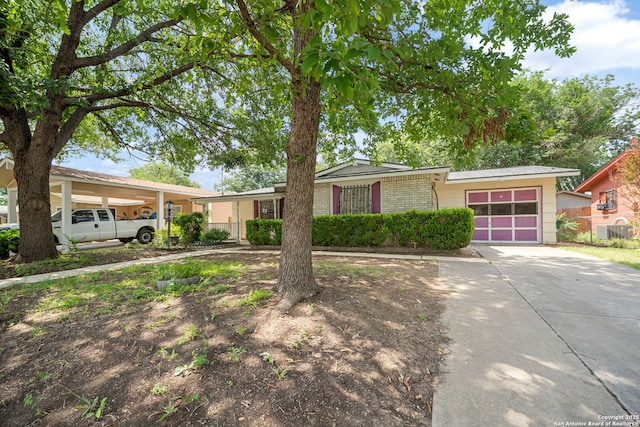 7022 Centergrove Dr, San Antonio, TX 78227 - view of front of property featuring an attached garage, brick siding, and concrete driveway