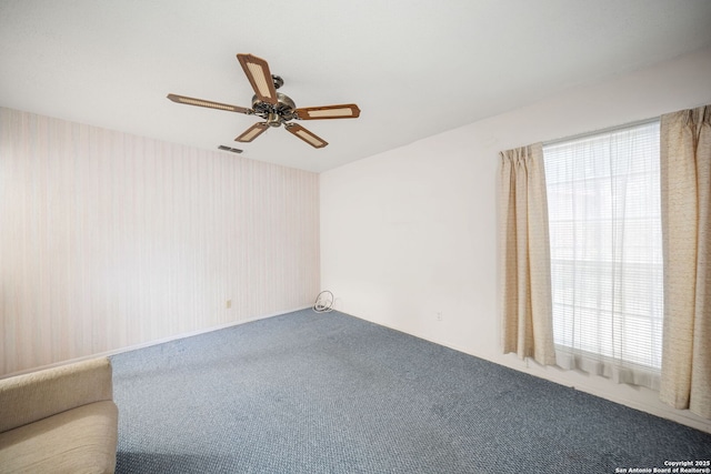 7022 Centergrove Dr, San Antonio, TX 78227 - spare room with carpet, healthy amount of natural light, ceiling fan, and wallpapered walls