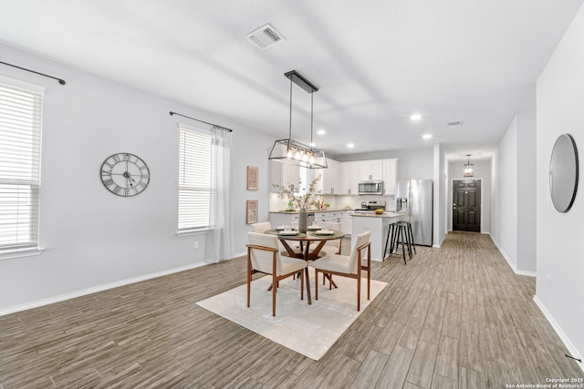 336 Salz, San Antonio, TX 78260 - dining room with light wood-style floors and recessed lighting
