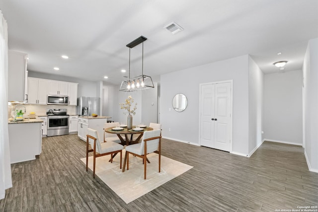 336 Salz, San Antonio, TX 78260 - dining area featuring recessed lighting, wood finished floors, and a chandelier