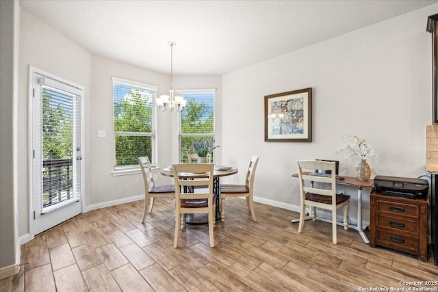 16327 Amistad Pass, San Antonio, TX 78247 - dining area featuring a chandelier and light wood finished floors