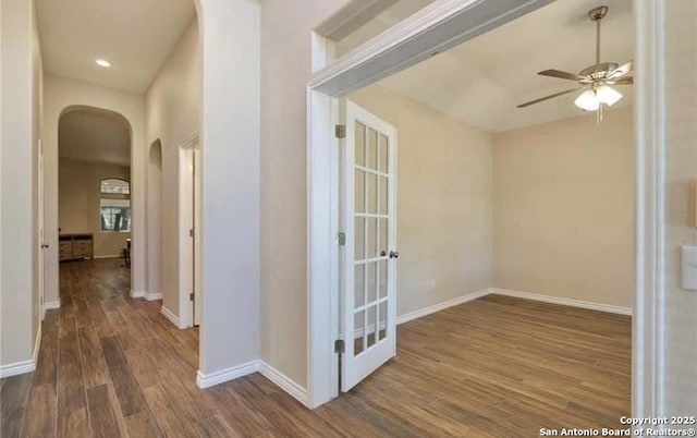 30184 Bridlegate, Bulverde, TX 78163 - hall featuring arched walkways and wood finished floors