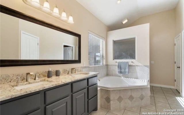 30184 Bridlegate, Bulverde, TX 78163 - full bath with double vanity, a garden tub, tile patterned flooring, and vaulted ceiling