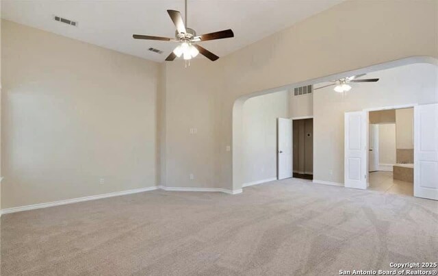 30184 Bridlegate, Bulverde, TX 78163 - unfurnished room with ceiling fan, light carpet, and arched walkways