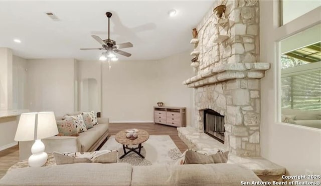 30184 Bridlegate, Bulverde, TX 78163 - living room with a fireplace, wood finished floors, and ceiling fan