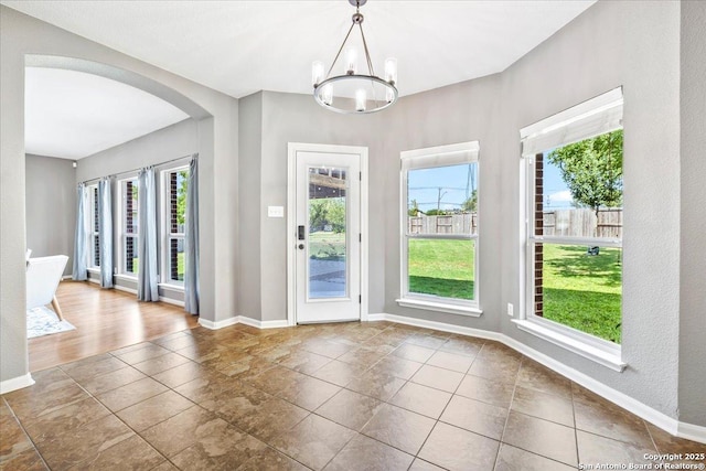 3607 Mill Mdw, San Antonio, TX 78247 - entrance foyer featuring arched walkways, a chandelier, and tile patterned floors