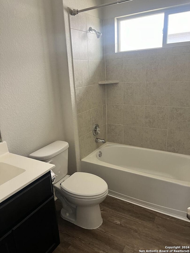 2649 Mccrae, New Braunfels, TX 78130 - full bath with vanity, wood finished floors,  shower combination, and a textured wall