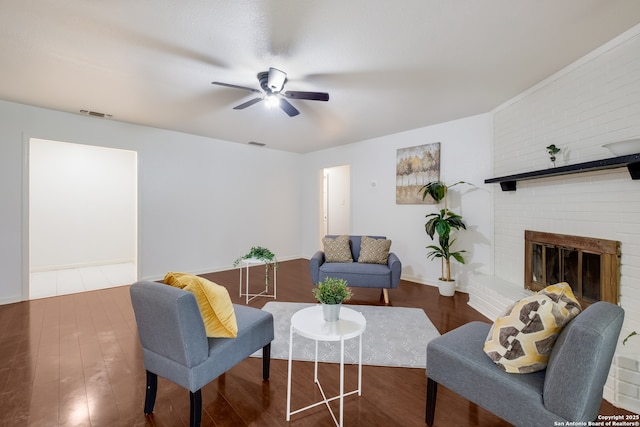 5707 Bogart, San Antonio, TX 78240 - living area featuring a ceiling fan, wood finished floors, and a brick fireplace