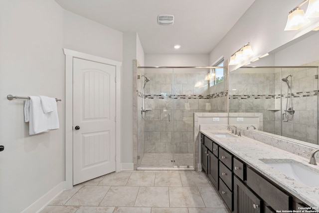 744 E Rio Azule, Pipe Creek, TX 78063 - bathroom with a shower stall, double vanity, and tile patterned flooring