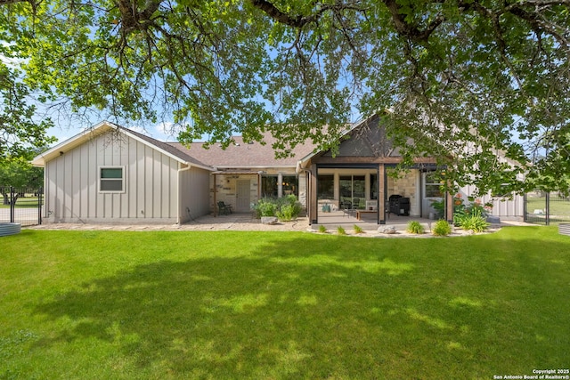 744 E Rio Azule, Pipe Creek, TX 78063 - rear view of property featuring board and batten siding, a patio area, roof with shingles, and stone siding