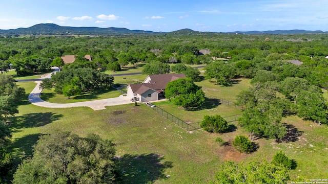 744 E Rio Azule, Pipe Creek, TX 78063 - view of subject property featuring a mountain backdrop and a forest