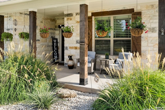 744 E Rio Azule, Pipe Creek, TX 78063 - doorway to property with stone siding and a porch