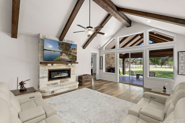 744 E Rio Azule, Pipe Creek, TX 78063 - living room with wood finished floors, a fireplace, and a ceiling fan