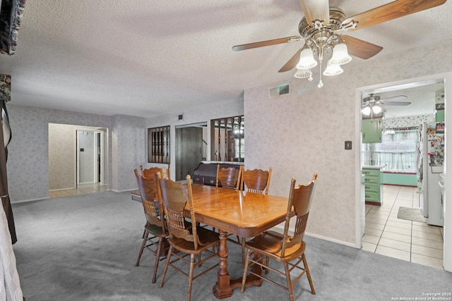 6210 Echo, Leon Valley, TX 78238 - carpeted dining area with ceiling fan, a textured ceiling, wallpapered walls, and tile patterned floors