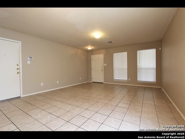 10235 Crystal, Universal City, TX 78148 - empty room with light tile patterned floors and baseboards