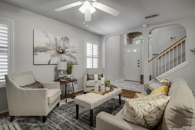 7902 Coastal Run, San Antonio, TX 78240 - living area featuring arched walkways, healthy amount of natural light, and ceiling fan