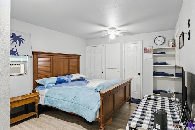 1105 Delgado St, San Antonio, TX 78207 - bedroom featuring wood finished floors, cooling unit, and ceiling fan