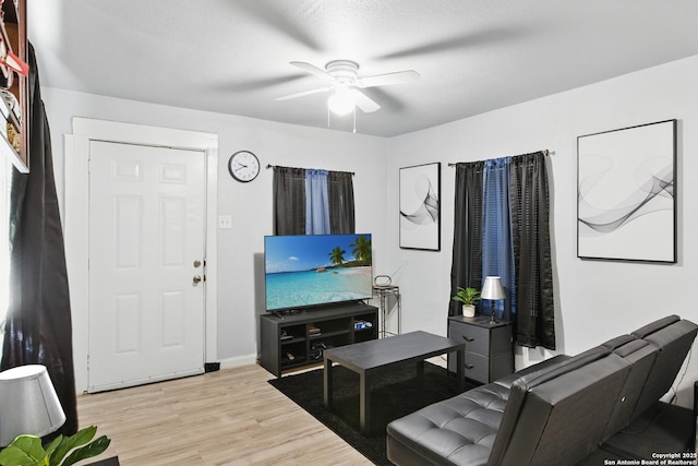 1105 Delgado St, San Antonio, TX 78207 - living area with ceiling fan and light wood finished floors