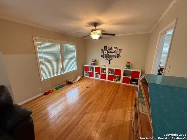 403 E Nottingham, San Antonio, TX 78209 - playroom with light wood-style flooring, a ceiling fan, and crown molding