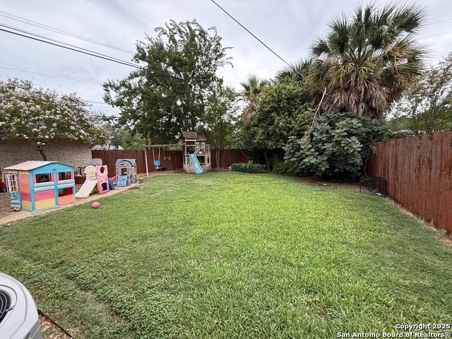 403 E Nottingham, San Antonio, TX 78209 - fenced backyard featuring a playground