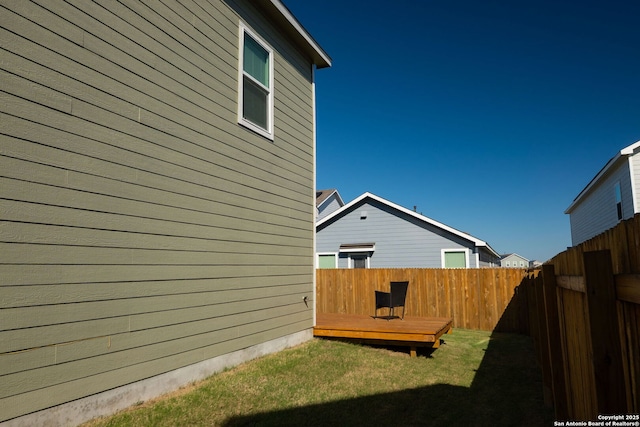 175 Amber, Maxwell, TX 78656 - fenced backyard with a wooden deck