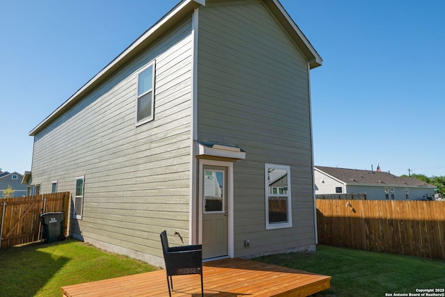 175 Amber, Maxwell, TX 78656 - rear view of house with a deck and a fenced backyard