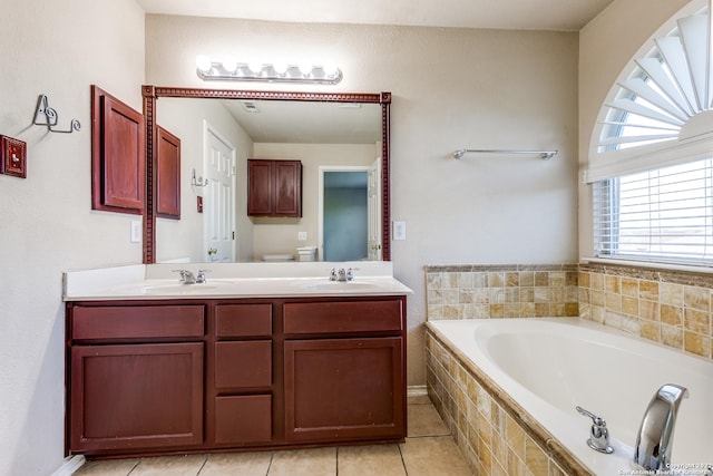 9619 Krier Vw, Converse, TX 78109 - bathroom featuring a garden tub, double vanity, and tile patterned flooring