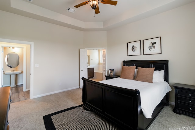 129 Thurston, Bastrop, TX 78602 - carpeted bedroom with ensuite bath and ceiling fan