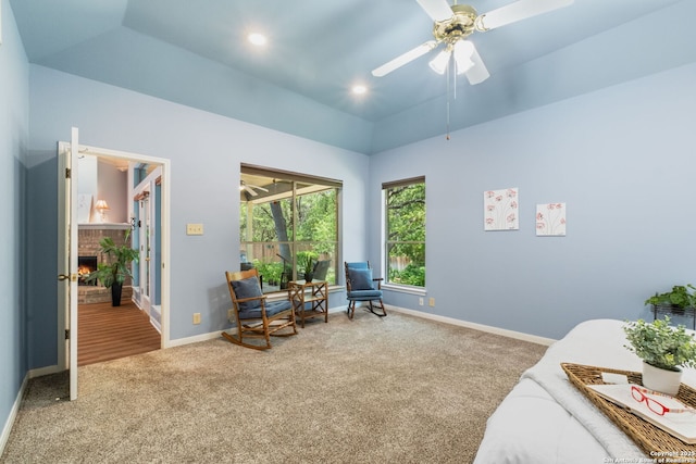 2430 Burning Trl, San Antonio, TX 78232 - living area featuring carpet, a fireplace, a ceiling fan, and vaulted ceiling