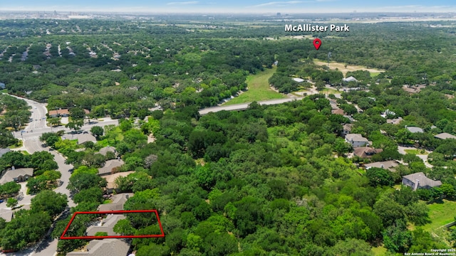 2430 Burning Trl, San Antonio, TX 78232 - aerial view of property and surrounding area with property parcel outlined and a heavily wooded area