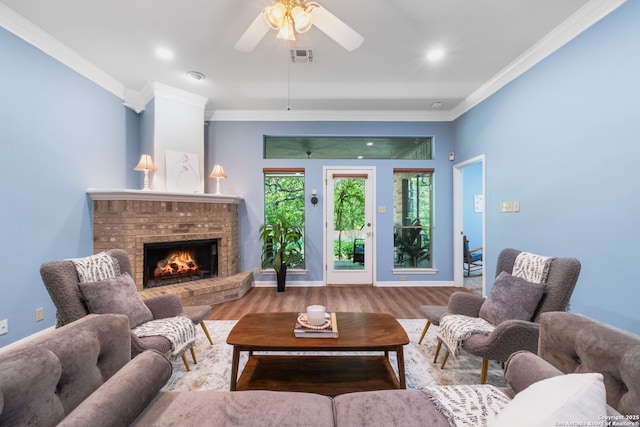 2430 Burning Trl, San Antonio, TX 78232 - living area with ceiling fan, a fireplace, ornamental molding, wood finished floors, and recessed lighting