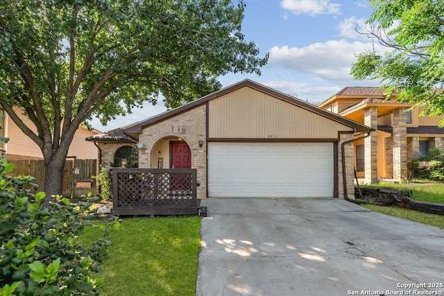 6411 Gray Rdg, San Antonio, TX 78233 - view of front of home with a garage, concrete driveway, and stone siding