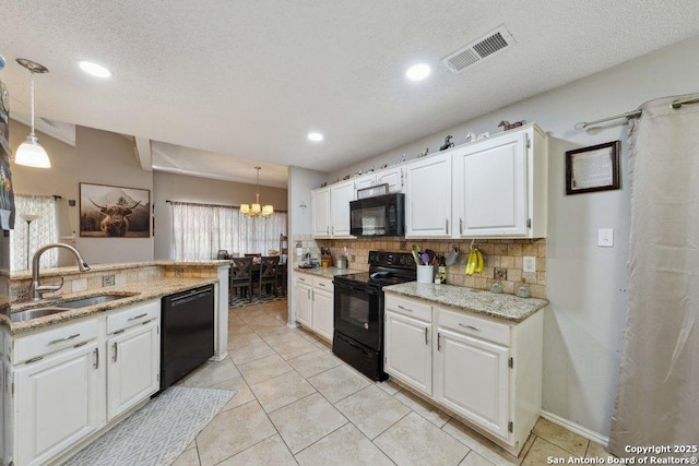 6411 Gray Rdg, San Antonio, TX 78233 - kitchen featuring black appliances, tasteful backsplash, a chandelier, white cabinetry, and a textured ceiling