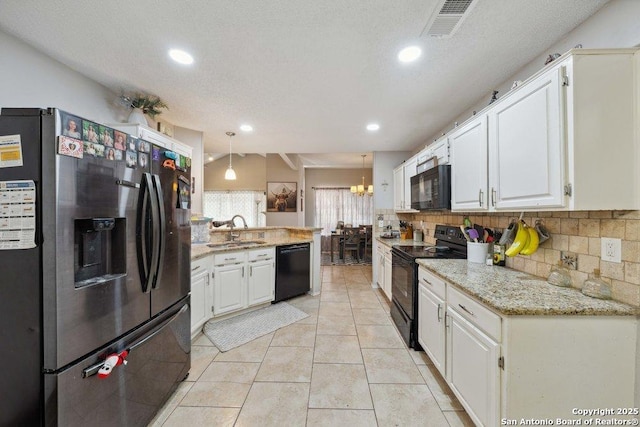 6411 Gray Rdg, San Antonio, TX 78233 - kitchen featuring black appliances, a peninsula, backsplash, white cabinetry, and recessed lighting