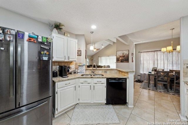 6411 Gray Rdg, San Antonio, TX 78233 - kitchen featuring freestanding refrigerator, black dishwasher, a chandelier, a peninsula, and white cabinetry