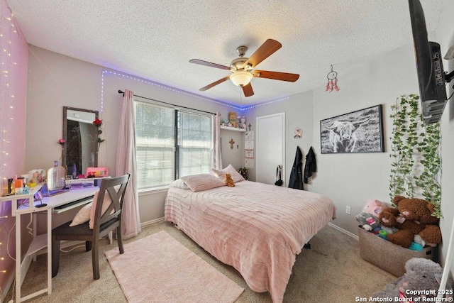 6411 Gray Rdg, San Antonio, TX 78233 - bedroom featuring carpet flooring, an office area, a textured ceiling, and a ceiling fan