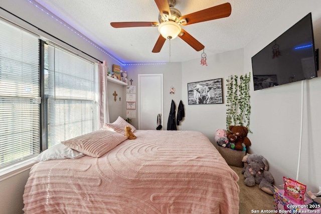 6411 Gray Rdg, San Antonio, TX 78233 - carpeted bedroom with ceiling fan and a textured ceiling